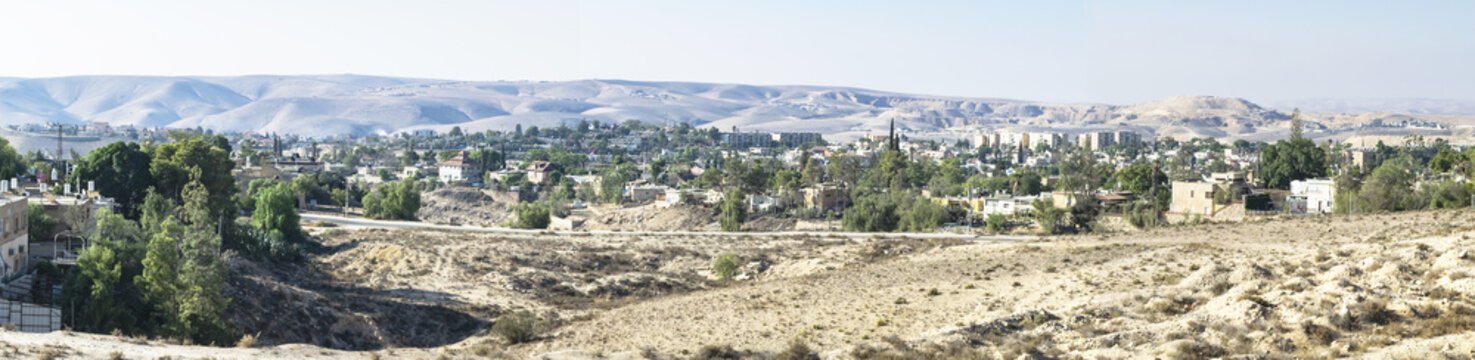 panorama of a neighborhood in Arad Israel on a clear fall day with desert mountains and bedouin villages in the background
