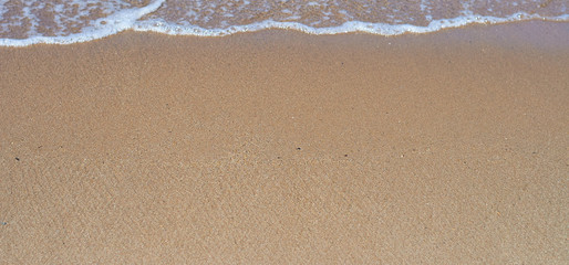 Wave on the sandy beach. Resort area of the Aegean coast of Turkey. Turgutreis , Bodrum.