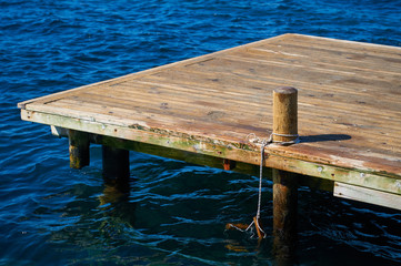 Wooden pier in the Aegean Sea in the resort of Turkey. Exit to the sea in the resort area of Turgutsreis, Bodrum.