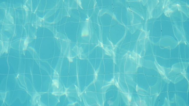  Arty background from celeste waters surging and sparkling in a soothing and inspiring way in a swimming pond on a sunny day in slow motion