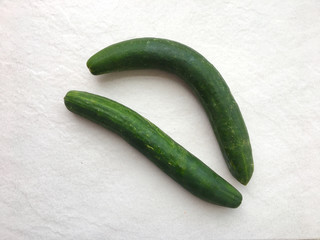 Two green cucumbers