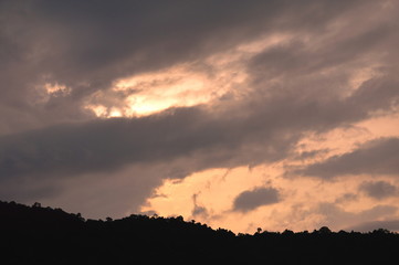 landscape of cloud floating on silhouette mountain peak
