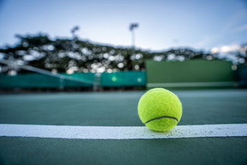 The beginning of a champion, Close up tennis ball on the courts background.
