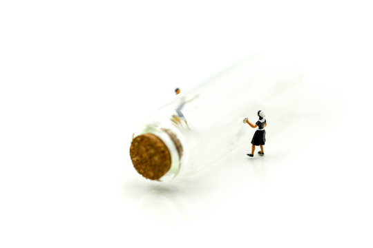 Miniature people : Maid or Housewife cleaning  with Bottle of Piill capsules,Health care concept.