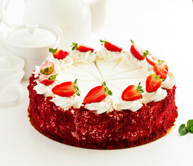 a piece of delicious red velvet cake on a plate.