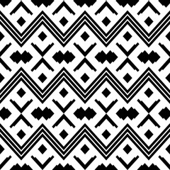 Ethnic style seamless pattern with zigzags in black and white. Abstract wallpaper