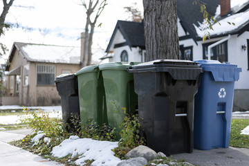 Garbage and recycling bins outside