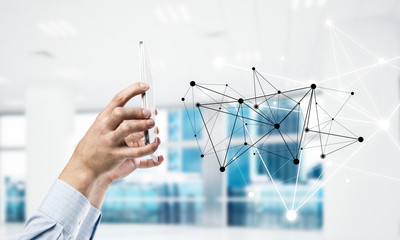 Business and technology concept with networking grid and man usi