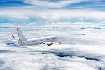 White airplane flying above cloud