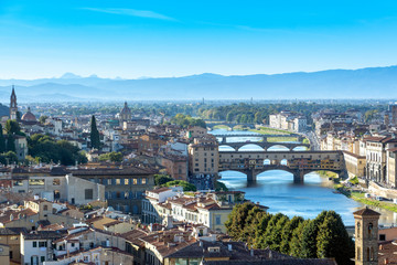 Fototapeta na wymiar Panoramic view of Florence's skyline before the sunset with the view of the famous Vecchio bridge and the Arno river.