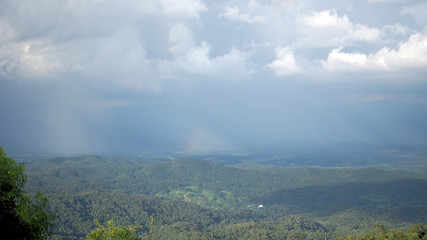 Landscape Mountain valley. Background blue sky with white full of rain clouds.