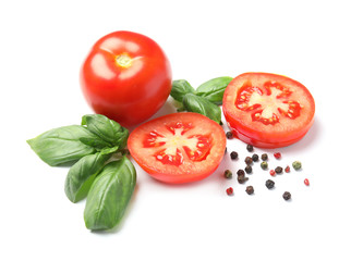 Fresh green basil leaves, tomatoes and pepper on white background