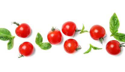 Fresh green basil leaves and cherry tomatoes on white background, top view