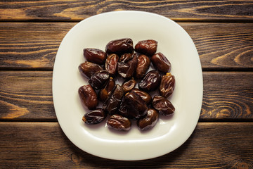Dates on a white dish