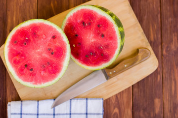 Fresh sliced watermelon wooden background