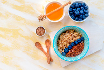 Buckwheat porridge in a bowl with flax seeds and blueberries. oncept healthy food, detox, diet, breakfast
