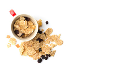 whole grain cereal flakes which mixed berry fruit and raisins for breakfast isolaed on white background