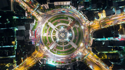 Aerial view beautiful pattern highway road intersection at night  for transportation, distribution or traffic background.