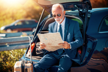 Young businessman travel with car