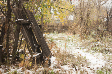 Fototapeta na wymiar abandoned house in the winter forest