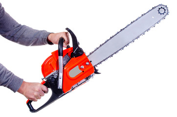 Chainsaw in the hands of an adult man on a white background