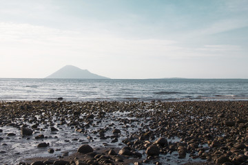 Manado beach overlooking the Manado Tua island (Old Manado)