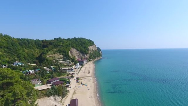 Flying drone beach сoastal zone, relax resort of Pitsunda pines, Abkhazia aerial footage, authentic view.