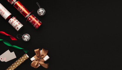 Christmas decoration flat lay on black background