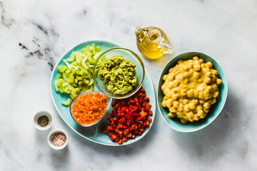 Ingredients for vegan fresh vegetable salad and chickpea in mango sauce. healthy food
