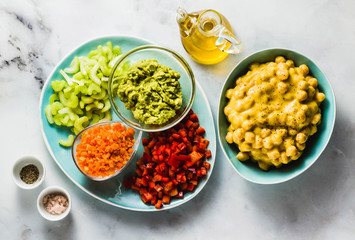 Ingredients for vegan fresh vegetable salad and chickpea in mango sauce. healthy food