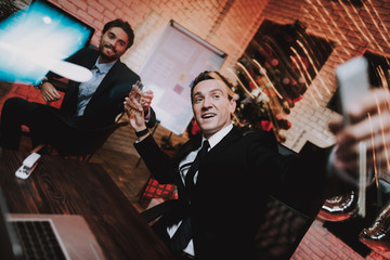 Businessman Using Smartphone on New Year Eve.