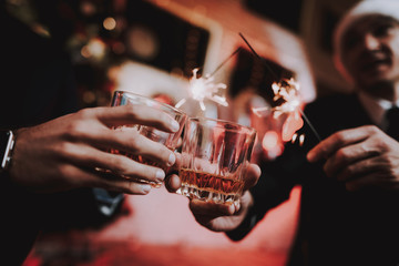 Close up. Businessmen Celebrate New Year in Office