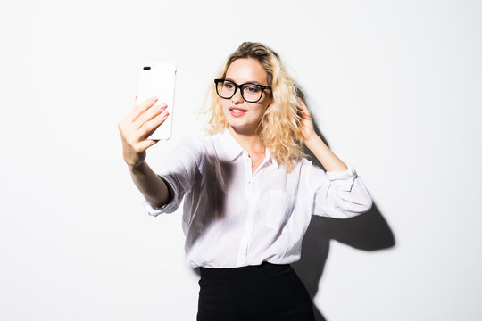 Happy Business Woman Looking Aside Talking Video Call By Phone Waving To Friends Isolated Over White Wall Backgound .