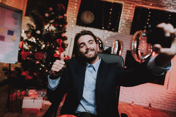 Businessman Using Smartphone on New Year Eve.