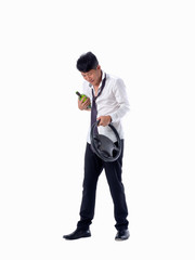 Obraz premium drunk business man wear black suit holding wine bottle and steering wheel on isolated white background