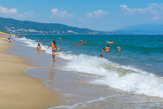 Asprovalta, Greece - August 20, 2018: Asprovalta and New Vrasna resort, Asprovalta beach. Sea view to Asprovalta at the foot of the green hills.