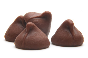 Chocolate chips morsels from top view isolated on white background