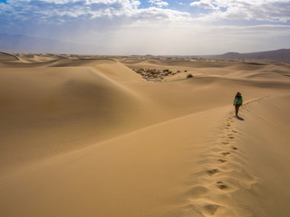 Fototapeta na wymiar Hiker on Sand Dune, Death Valley Dunes, Trail on Ridge