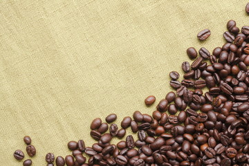 Coffee beans on fabric with copy space for text.