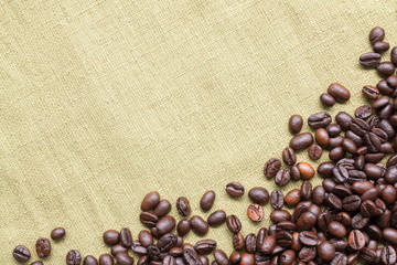 Coffee beans on fabric with copy space for text.