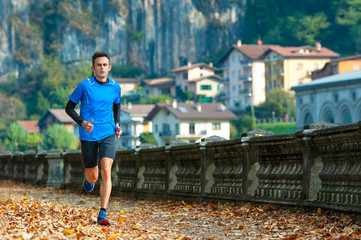 High-level cross-country runner during a training session in the city