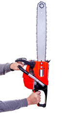 A man holds a chainsaw in his hands on a white background
