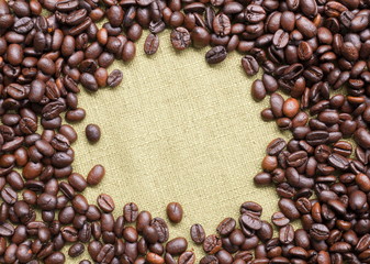 Coffee beans on fabric with copy space for text.