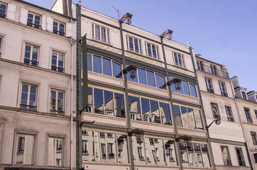 Building facade with beautiful building reflections in Paris