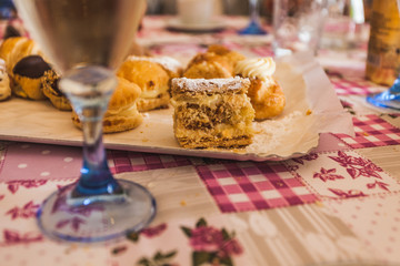 Cream pastry ready to be eaten with white wine glass
