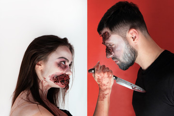Halloween makeup concept for horror story. Girl hold a knife at the chest of a young man at heart...