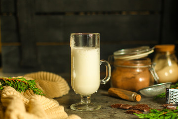 Latte - a cup of coffee with milk in a transparent cup on the table. top view.