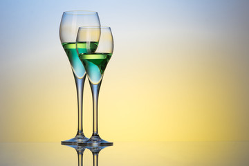two glasses with cocktails 