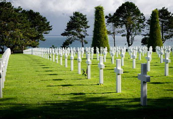Fototapeta na wymiar White crosses in American War Cemetery near Omaha Beach, Normandy (Colleville-sur-Mer), France