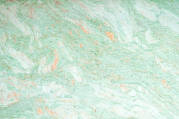 green marble texture. A closed up details of marble floor pattern in green and orange texture for background.